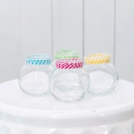 Set of colourful small glass jars